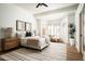 Bright bedroom with a neutral palette, shutters, and a cozy bay window seating area at 9128 N 70Th St, Paradise Valley, AZ 85253