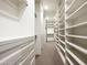 Walk-in closet with custom built-in shelves and drawers for optimal storage space at 9128 N 70Th St, Paradise Valley, AZ 85253