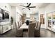 Open concept dining room boasts modern light fixture, seating for eight and a view to living and dining spaces at 9128 N 70Th St, Paradise Valley, AZ 85253