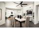 Open concept dining room boasts modern light fixture, seating for eight and a view to living and dining spaces at 9128 N 70Th St, Paradise Valley, AZ 85253