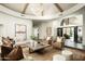 Spacious living room with elegant decor, lots of seating, a fireplace, and a view to the entrance at 9128 N 70Th St, Paradise Valley, AZ 85253