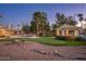 Scenic backyard putting green with lush landscaping, perfect for outdoor recreation and enjoyment at 9128 N 70Th St, Paradise Valley, AZ 85253