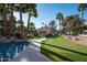 Backyard putting green with gazebo, sports court, and waterfall pool feature at 9128 N 70Th St, Paradise Valley, AZ 85253