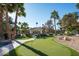 Backyard putting green with gazebo, sports court, and waterfall pool feature at 9128 N 70Th St, Paradise Valley, AZ 85253