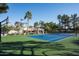 Full size tennis court with basketball hoop and seating area at 9128 N 70Th St, Paradise Valley, AZ 85253