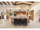 Gourmet kitchen featuring a center island, custom cabinetry, and stone countertops at 10002 E Adele Ct, Scottsdale, AZ 85255