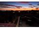 Enjoy views of the city lights from the rooftop deck at dusk at 10002 E Adele Ct, Scottsdale, AZ 85255