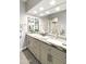 Stylish bathroom featuring a double sink vanity, granite countertops and large mirror at 10232 E Lambert Dr, Sun Lakes, AZ 85248