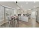 Bright kitchen with modern appliances, bar seating, and an adjacent breakfast nook with ample natural light at 10232 E Lambert Dr, Sun Lakes, AZ 85248