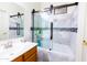 Bright bathroom with a glass enclosed shower and vanity at 11197 W Coronado Rd, Avondale, AZ 85392
