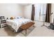 Cozy bedroom with a comfortable bed, bench and neutral decor at 11197 W Coronado Rd, Avondale, AZ 85392