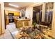 Eat-in kitchen with wood cabinets, tile floors, and access to the backyard at 11197 W Coronado Rd, Avondale, AZ 85392