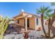 View of the backyard featuring desert landscaping, covered patio, potted plants and perimeter block fencing at 12224 N Gambel Dr, Fountain Hills, AZ 85268