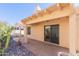 Covered patio with desert landscaping featuring rocks and cacti, providing a relaxing outdoor space at 12224 N Gambel Dr, Fountain Hills, AZ 85268