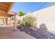 Back patio with desert landscaping, a rock garden, cacti, and a covered seating area, perfect for outdoor relaxation at 12224 N Gambel Dr, Fountain Hills, AZ 85268