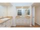Bright bathroom with double sink, tile floor, and white cabinets at 12224 N Gambel Dr, Fountain Hills, AZ 85268