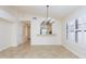 Open dining area featuring tile floors, chandelier, breakfast bar, and shuttered window at 12224 N Gambel Dr, Fountain Hills, AZ 85268