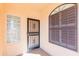Front entryway featuring a security door, glass block accent, arched window, and textured stucco exterior at 12224 N Gambel Dr, Fountain Hills, AZ 85268