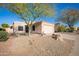 Single-story home featuring desert landscaping, a two-car garage, and a tile roof set against a clear blue sky at 12224 N Gambel Dr, Fountain Hills, AZ 85268
