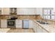 Gourmet kitchen featuring granite countertops, stainless steel appliances, and white cabinets at 12224 N Gambel Dr, Fountain Hills, AZ 85268