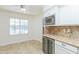 Breakfast nook features ceiling fan, plantation shutters, and a built in wine fridge at 12224 N Gambel Dr, Fountain Hills, AZ 85268