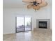 Close up view of the living room featuring neutral walls, a fireplace, and a sliding glass door at 12224 N Gambel Dr, Fountain Hills, AZ 85268
