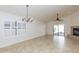 Spacious living room featuring neutral walls, a fireplace, ceramic tile flooring, and a sliding glass door at 12224 N Gambel Dr, Fountain Hills, AZ 85268