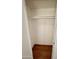 Empty closet features a wooden floor and a shelf with a hanging bar at 12429 N 111Th Dr, Youngtown, AZ 85363