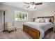 Comfortable bedroom featuring a ceiling fan and a stylish bed frame with convenient storage drawers at 12639 W Prospect Dr, Sun City West, AZ 85375