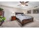 Comfortable bedroom featuring a ceiling fan and a stylish bed frame with convenient storage drawers at 12639 W Prospect Dr, Sun City West, AZ 85375