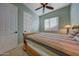 Bedroom featuring a wooden bed frame, carpet, and a ceiling fan for a comfortable feel at 15305 S 180Th Ave, Goodyear, AZ 85338