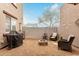 Intimate backyard patio, featuring a BBQ grill, a stone fire pit, and seating at 16350 N Desert Sage St, Surprise, AZ 85378