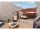 Inviting patio area with comfortable seating, fire pit, and umbrella, designed for outdoor enjoyment at 16350 N Desert Sage St, Surprise, AZ 85378