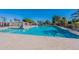 Large community pool with plenty of lounge space under the bright, sunny sky at 1767 W Kiowa Ave, Mesa, AZ 85202