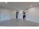 An open living room features tiled floors, recessed lighting, white walls, and access to other rooms at 1767 W Kiowa Ave, Mesa, AZ 85202