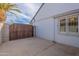 Gated side yard entrance provides privacy and security to the property at 1767 W Kiowa Ave, Mesa, AZ 85202