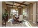 Dining room with coffered ceilings, chandelier, and large windows with views at 19839 N 267Th Ave, Buckeye, AZ 85396