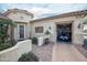 Stunning home featuring a private garage with a golf cart and an inviting landscaped entrance at 19839 N 267Th Ave, Buckeye, AZ 85396