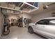 Spacious garage with overhead storage racks and epoxy flooring at 19839 N 267Th Ave, Buckeye, AZ 85396