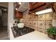 Close up of the kitchen gas cooktop, tile backsplash, and dark wood cabinetry at 19839 N 267Th Ave, Buckeye, AZ 85396