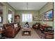 Inviting living room featuring a comfortable leather sofa and stylish decor at 19839 N 267Th Ave, Buckeye, AZ 85396