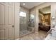 A gorgeous walk-in shower with decorative tile and bench at 19839 N 267Th Ave, Buckeye, AZ 85396