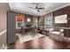 Office or bedroom showcasing windows, hardwood floors, updated lighting, and a peaceful ambiance at 20821 W Ridge Rd, Buckeye, AZ 85396