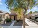 Charming two-story home with a covered front porch, landscaped yard, and extended driveway at 20821 W Ridge Rd, Buckeye, AZ 85396