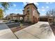Charming two-story home with a well-maintained yard, stone accents, and a covered front porch at 20821 W Ridge Rd, Buckeye, AZ 85396