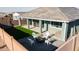 Backyard features a fire pit with chairs, perfect for outdoor gatherings, along with a patio, grill, and hot tub at 23282 S 229Th Pl, Queen Creek, AZ 85142
