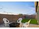 Spacious backyard features a fire pit and manicured artificial turf, perfect for outdoor enjoyment at 23282 S 229Th Pl, Queen Creek, AZ 85142