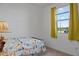 Bright bedroom with natural light, a playful animal themed bedspread and yellow curtains at 23282 S 229Th Pl, Queen Creek, AZ 85142