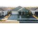 Beautiful single-Gathering home with a well-manicured lawn, two-car garage and neutral-colored exterior at 23282 S 229Th Pl, Queen Creek, AZ 85142