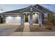 Charming single-story home with a two-car garage and well-manicured landscaping at 23282 S 229Th Pl, Queen Creek, AZ 85142